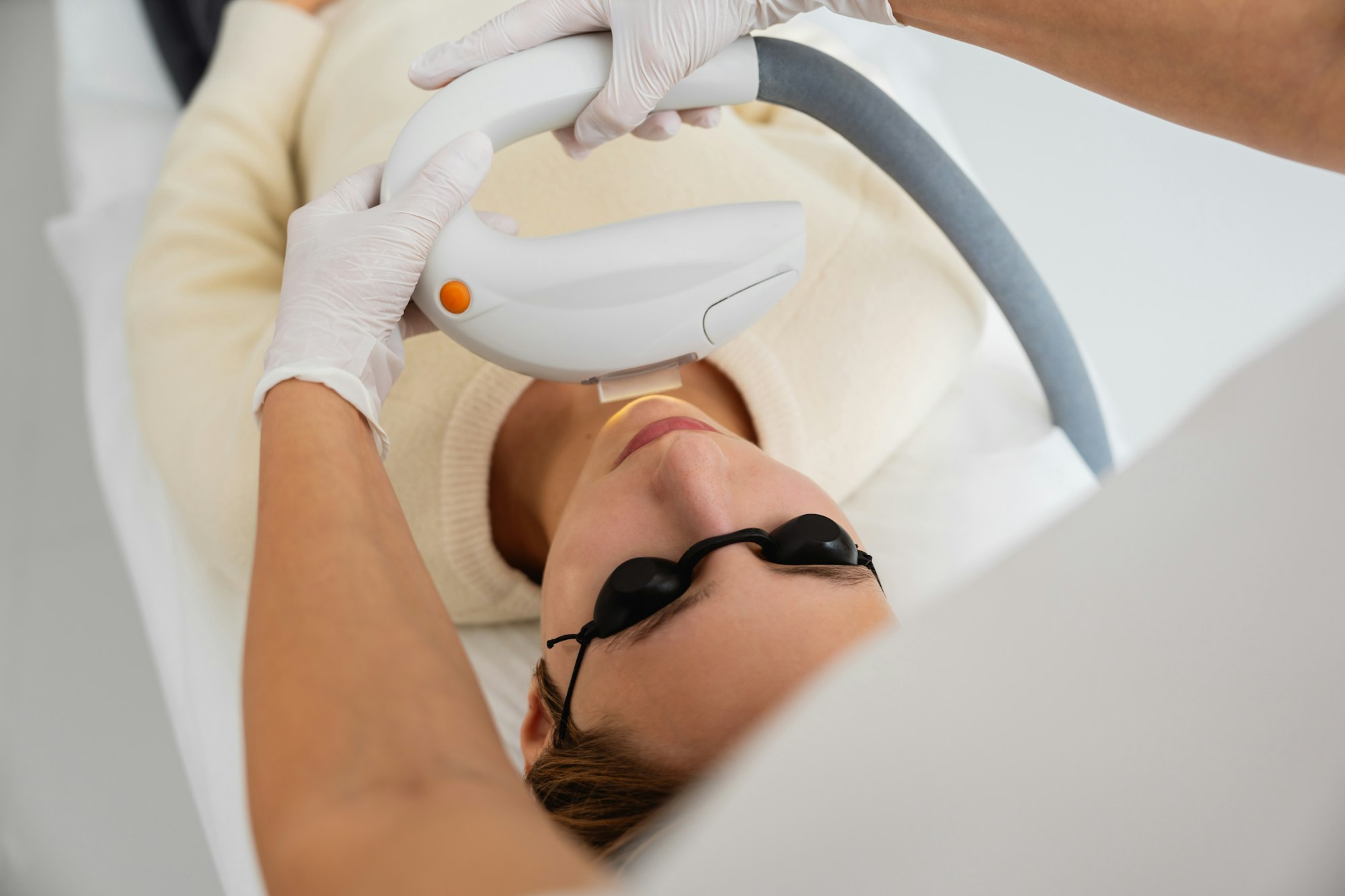 Phototherapy, photorejuvenation, IPL in a beauty salon. Care for a woman's face.